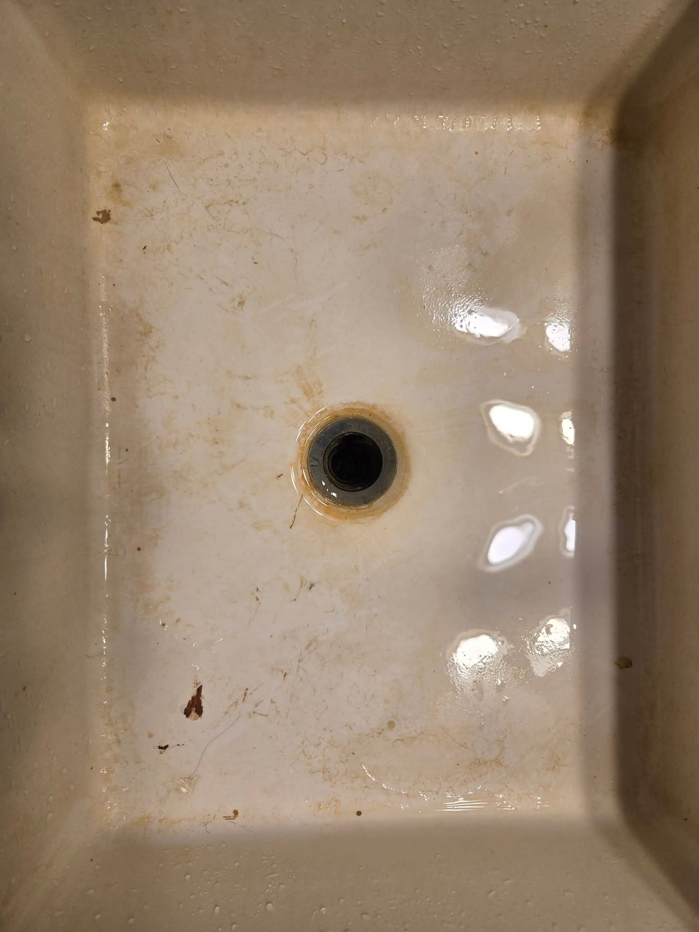 Before cleaning — stained and dirty sink